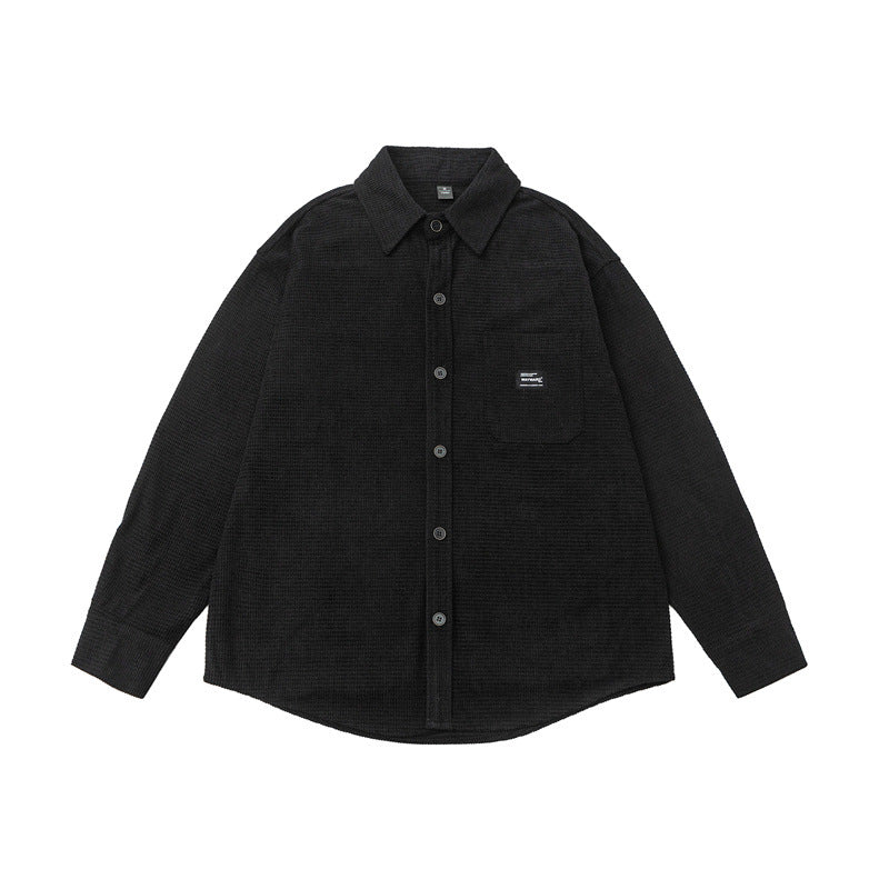 Washed and worn solid color long sleeved men's workwear shirt