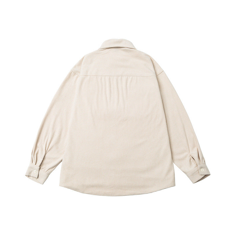 Washed and worn solid color long sleeved men's workwear shirt