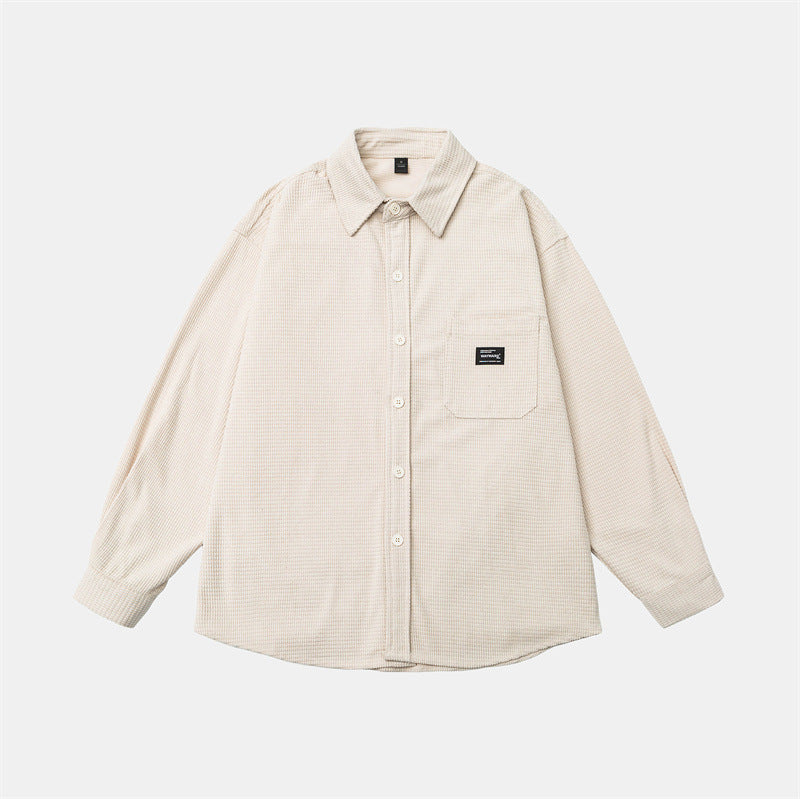 Washed and worn solid color long sleeved men's workwear shirt