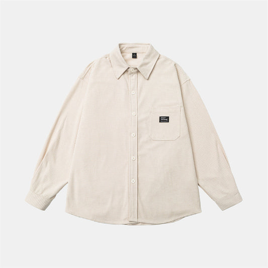 Washed and worn solid color long sleeved men's workwear shirt
